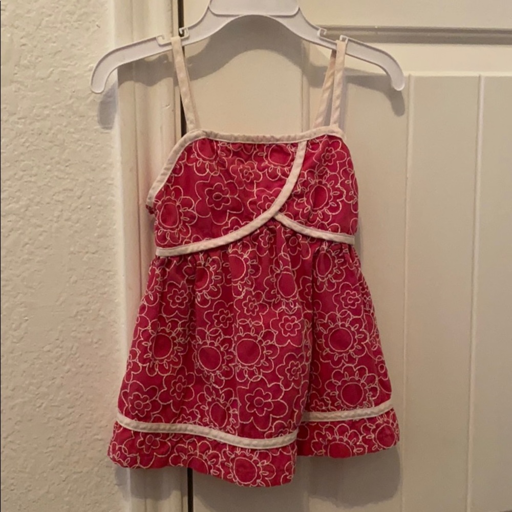 Cute pink toddler dress with white flower design